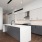 Open kitchen and living room with plenty of natural light.