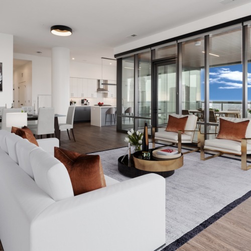 Living Room Spacious and well lit living room with wood flooring, large windows and open access to the kitchen