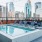 Large pool with shaded seating and clubhouse access.