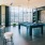 Resident clubhouse with ample seating, fireplace, demo kitchen and TVs