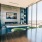Resident clubhouse with ample seating, fireplace, demo kitchen and TVs