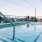 Large pool with shaded seating and clubhouse access.